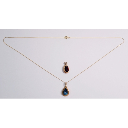 443 - An Edwardian 9 carat gold pendant necklace set blue topaz, 1.6g and a 9 carat gold pendant set garne... 