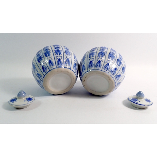 46 - A pair of Chinese blue and white pumpkin shaped ginger jars with lids 11cm high