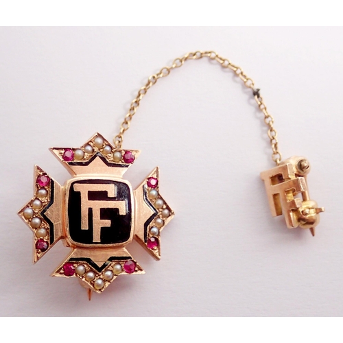 466 - A 9 carat gold pin brooch enamelled 'FF' with ruby and seed pearl set sides and safety 'FF' pin, 2.5... 