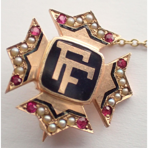 466 - A 9 carat gold pin brooch enamelled 'FF' with ruby and seed pearl set sides and safety 'FF' pin, 2.5... 