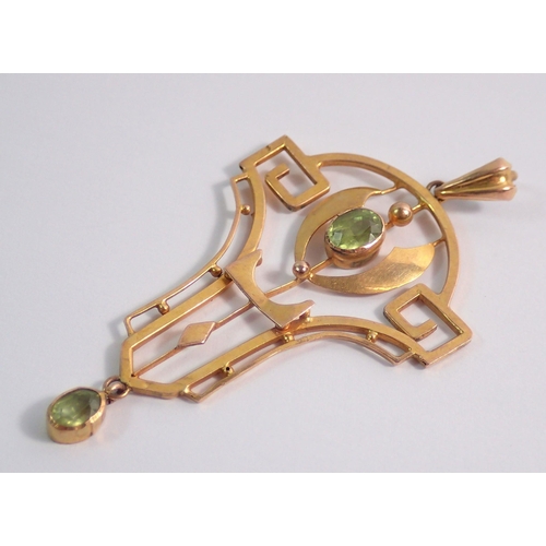 467 - An Edwardian 9 carat gold openwork Art Nouveau pendant set peridot, 5.5cm, 2.5g