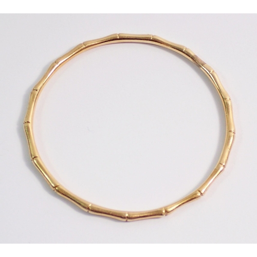 469 - A gold bamboo effect child's bangle, unmarked but tested as 14ct gold, 13g, internal measurement 5.3... 