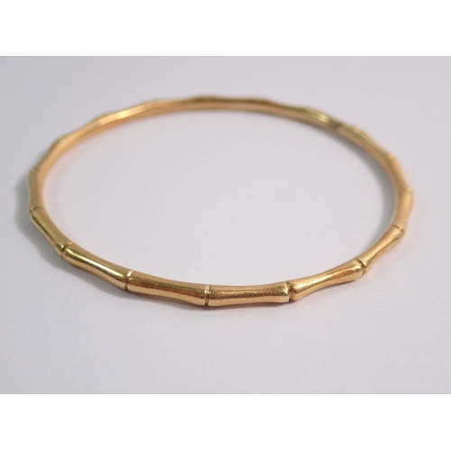 469 - A gold bamboo effect child's bangle, unmarked but tested as 14ct gold, 13g, internal measurement 5.3... 