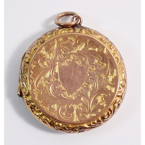 471 - A 9 carat gold back and front circular engraved locket, 6.3g, 2.8cm diameter