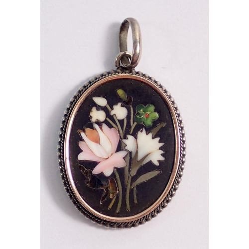 480 - A floral pietra dura oval pendant in white metal mount, oval 2.5 x 2cm