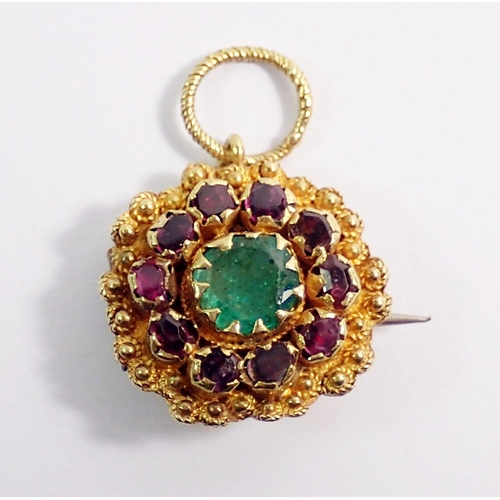 488 - An early 19th century yellow metal small brooch or pendant set emerald within ruby surround, 1.2cm d... 