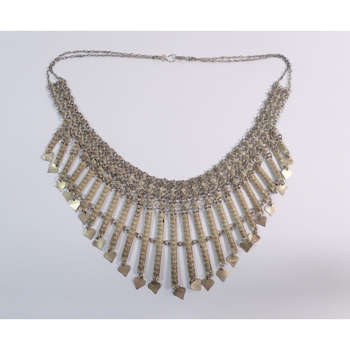 541 - A late 19th century Maltese white metal fringe necklace with heart form drops