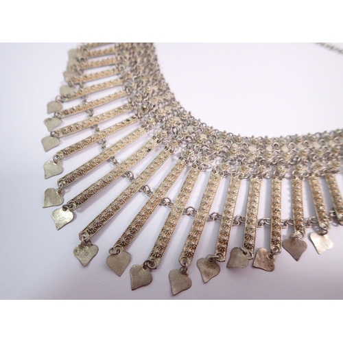 541 - A late 19th century Maltese white metal fringe necklace with heart form drops