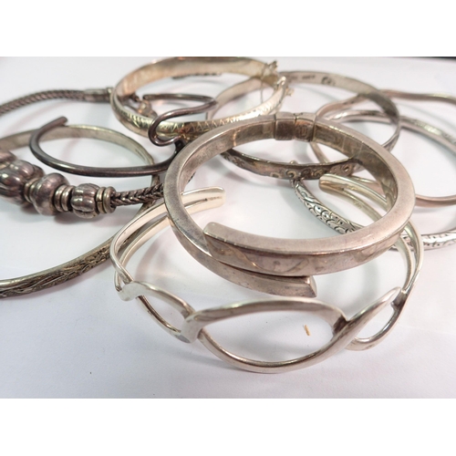 548 - A quantity of silver bracelets, 198g plus six white metal ones