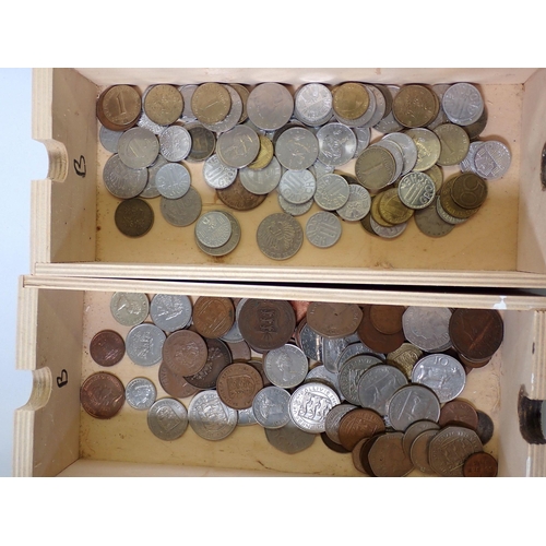 622 - A nine drawer wooden box with a selection of world coins including Channel Islands, India, Malta etc