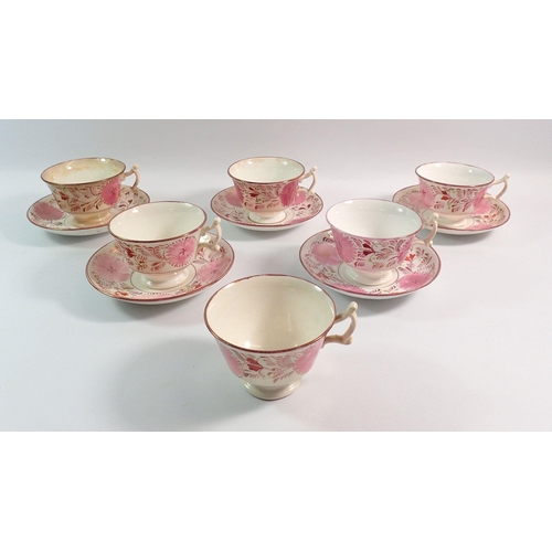 67 - A Victorian pink lustre set of six cups and five saucers with floral decoration