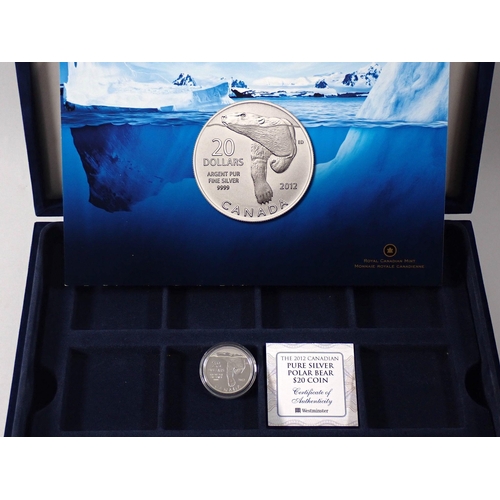 787 - A 2012 London pure silver polar bear $20 coin with COA plus a group of 13 London .500 silver one dol... 