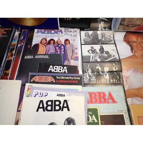 892 - A collection of Abba memorabilia including Abba magazines, badges, holograph picture, programme, bag... 