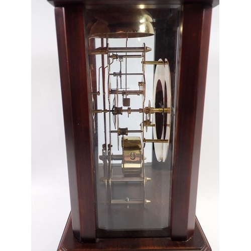 899 - A mahogany finish 8 day skeleton clock striking the hours on a bell, lacking original glass panel ba... 