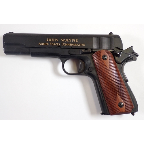 908 - A Franklin Mint John Wayne Armed Forces commemorative replica .45 Automatic, the replica with facsim... 