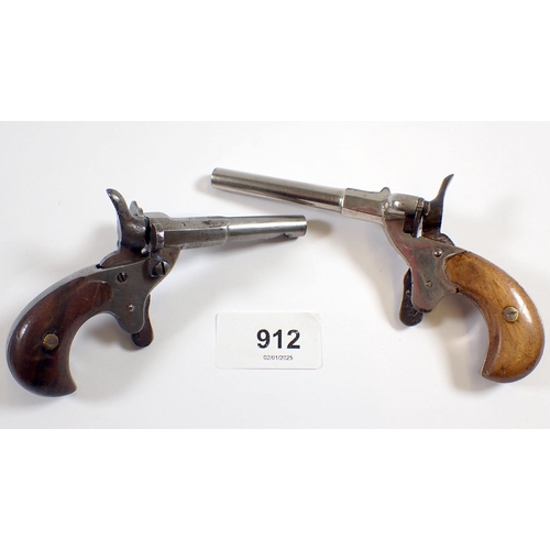 912 - Two antique starting guns