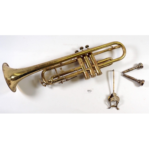 913 - An old brass trumpet and a Malerne of Paris clarinet, both cased