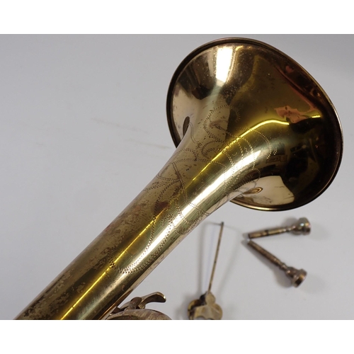 913 - An old brass trumpet and a Malerne of Paris clarinet, both cased