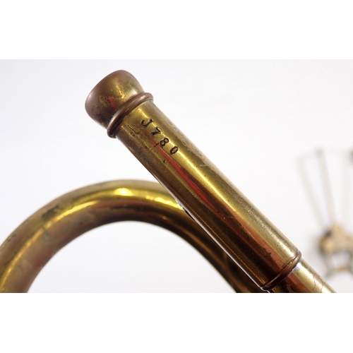 913 - An old brass trumpet and a Malerne of Paris clarinet, both cased