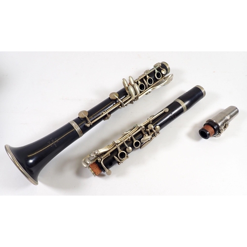 913 - An old brass trumpet and a Malerne of Paris clarinet, both cased