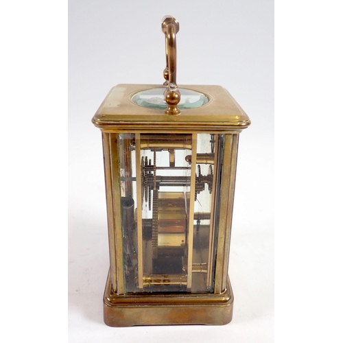 926 - A brass carriage clock, 11cm tall, rear glass panel a/f