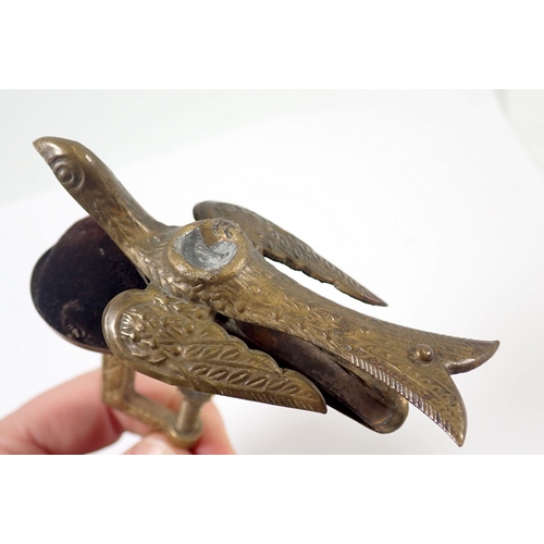 942 - An antique brass sewing clamp with pin cushion and bird surmount, 13cm tall