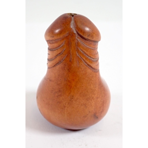 949 - A Japanese phallic carved wood netsuke, 4.5cm tall