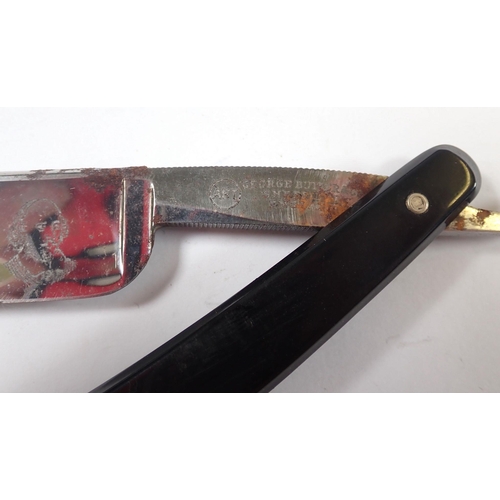 966 - An amber cheroot with yellow metal rim - cased and a cut throat razor 'Butlers Keen'