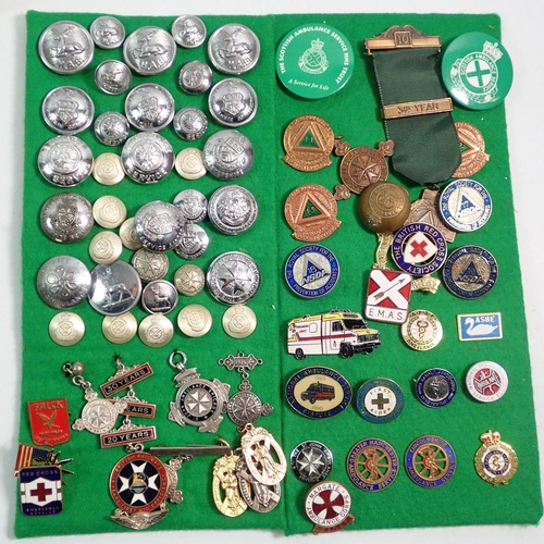 973 - A box of collectables including military interest badges, buttons, replica medals, ambulance and par... 