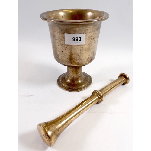 983 - A large Middle Eastern brass pestle and mortar, 16cm tall