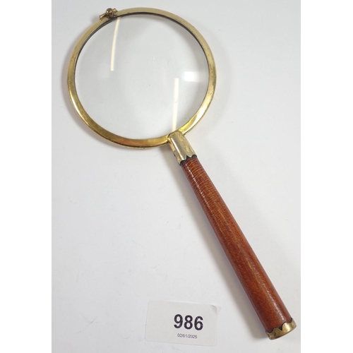 986 - A vintage English made magnifying glass with leather handle by P H Vogel & Co, 21cm long