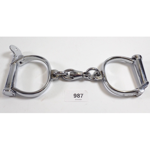 987 - A pair of handcuffs with key