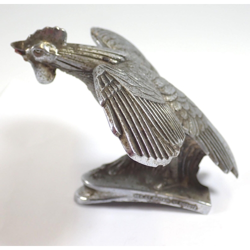 988 - An early 20th century metal Art Deco cockerel car mascot with registration mark, 11cm long