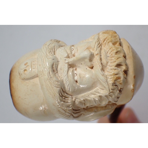 995 - A 19th century meerschaum pipe carved in the form of a mans head, 12.5cm and another with engraved d... 