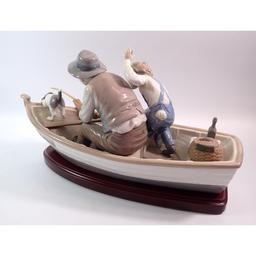 112 - A large  Lladro group 'Fishing with Gramps' 40cm long, on stand