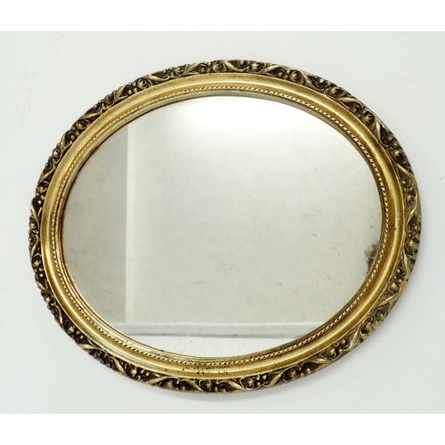 1139 - An oval gilt framed mirror, 54 x 44cm