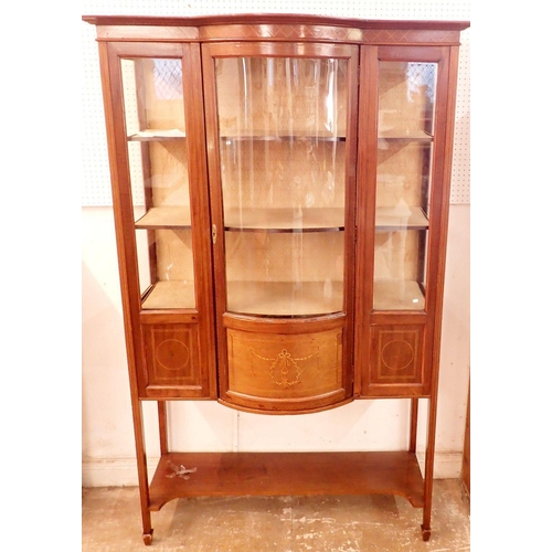 1143 - An Edwardian mahogany bow front display cabinet with single door over undertier, 114cm wide x 181cm ... 