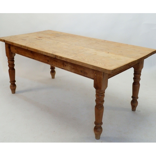 1146 - A pine scrub top kitchen dining table on turned leg supports, 183 x 91.5cm wide x 78cm high