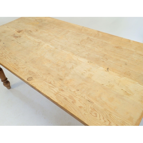 1146 - A pine scrub top kitchen dining table on turned leg supports, 183 x 91.5cm wide x 78cm high