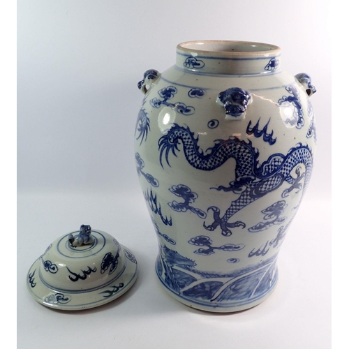 127 - A large Chinese blue and white vase and cover painted dragons chasing a flaming pearl, 44cm