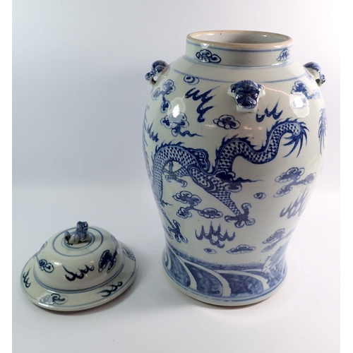 127 - A large Chinese blue and white vase and cover painted dragons chasing a flaming pearl, 44cm