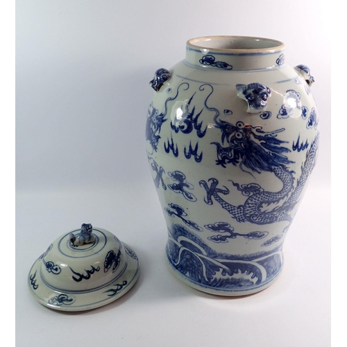 127 - A large Chinese blue and white vase and cover painted dragons chasing a flaming pearl, 44cm