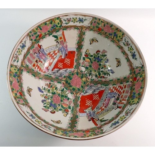 128 - A large modern Chinese Canton style bowl decorated interior scenes and panels of flowers, 35cm diame... 