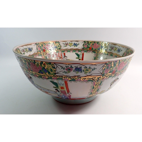 128 - A large modern Chinese Canton style bowl decorated interior scenes and panels of flowers, 35cm diame... 