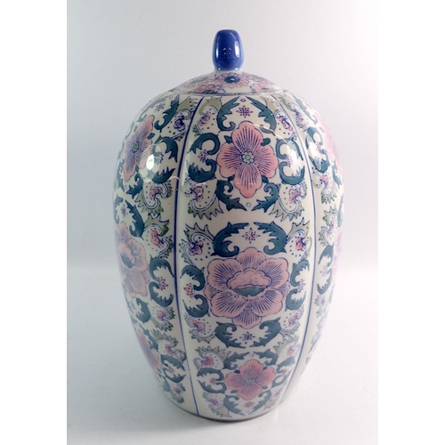 129 - A large Chinese pastel floral vase and cover, 38cm tall, full length crack