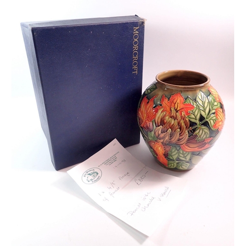 141 - A Moorcroft Flame of Forest vase by Philip Gibson, 1997 - boxed with receipt, 21cm tall