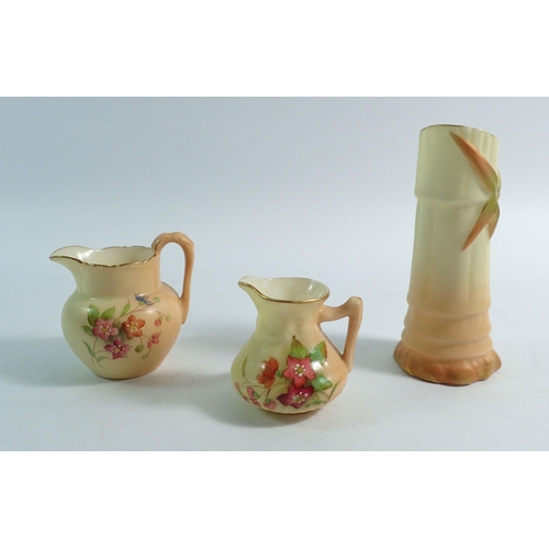 151 - Two Royal Worcester ivory blush miniature jugs painted flowers, G1057 and G1022 and a bamboo spill v... 