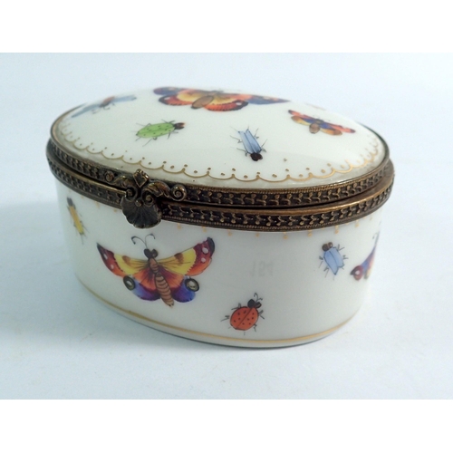 154 - A Sevres oval trinket box painted butterflies with gilt metal mounts, 8.5cm wide