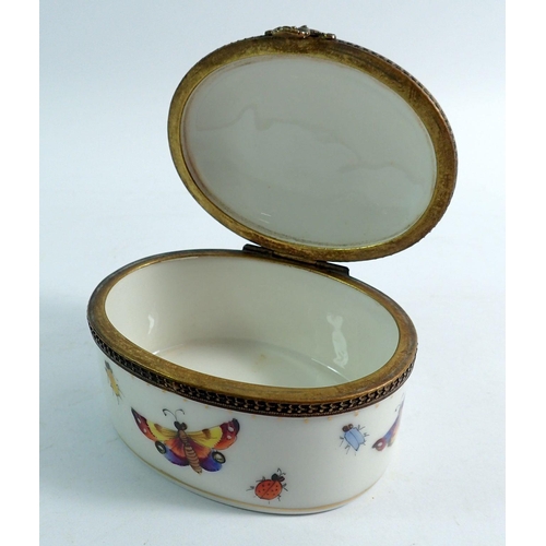 154 - A Sevres oval trinket box painted butterflies with gilt metal mounts, 8.5cm wide