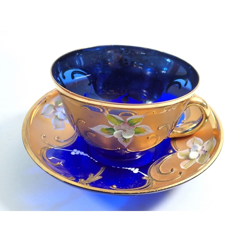 180 - A Murano glass enamelled tea cup and saucer - boxed